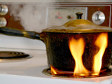 pot on stove that is catching on fire