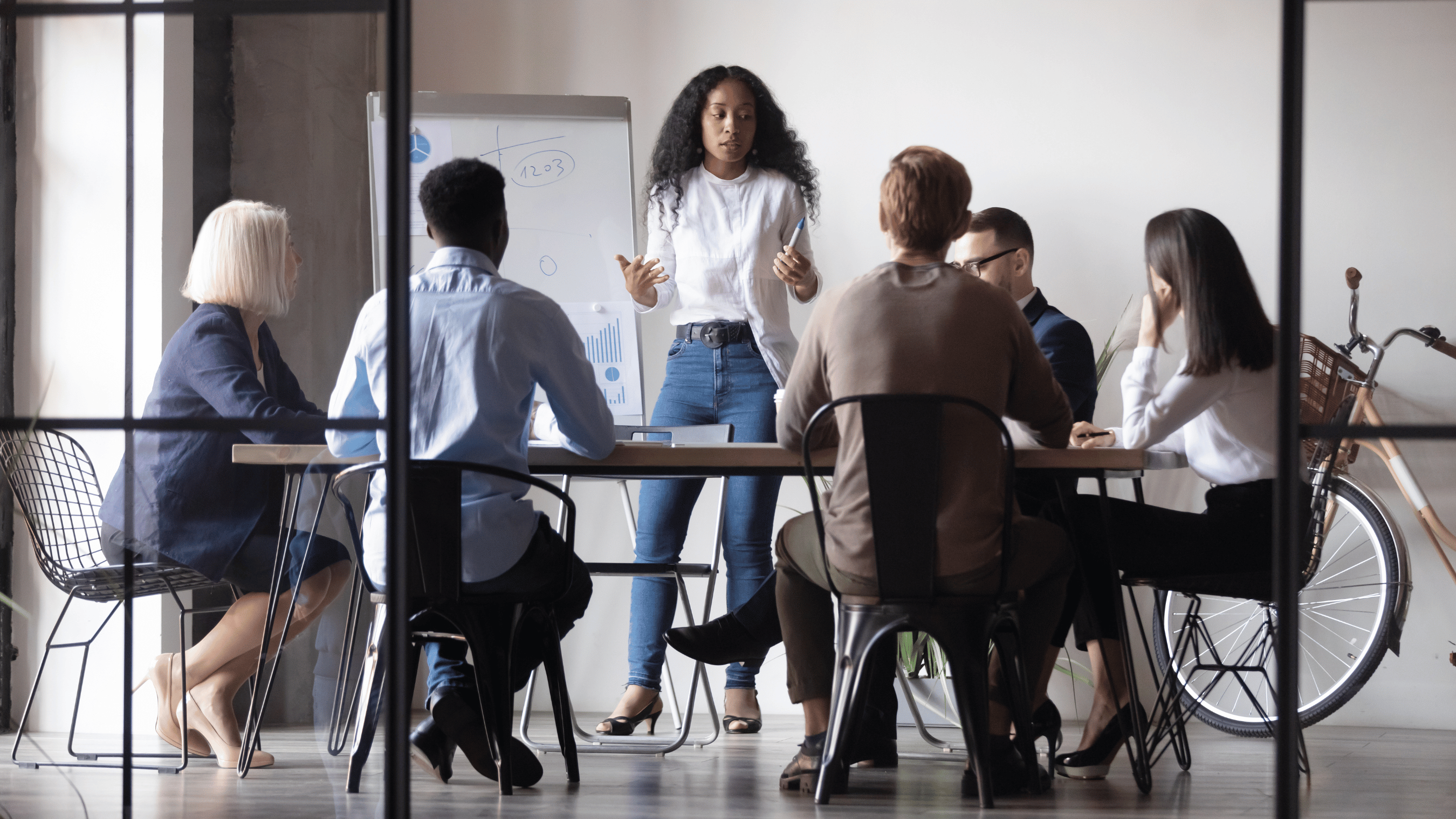 people around a table in a discussion