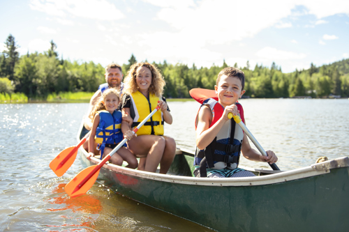 Family canoeing on the lake